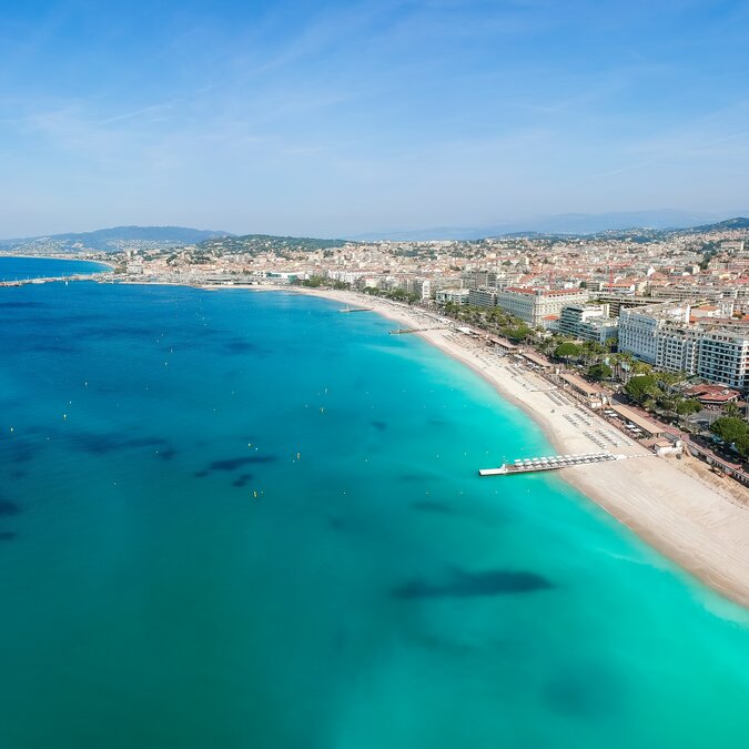 Aerial view of Cannes with beach, turquoise sea and La Croisette | © shutterstock_2332612263