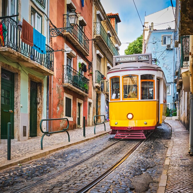 Yellow tram in a Lisbon street | © shutterstock_2322035815