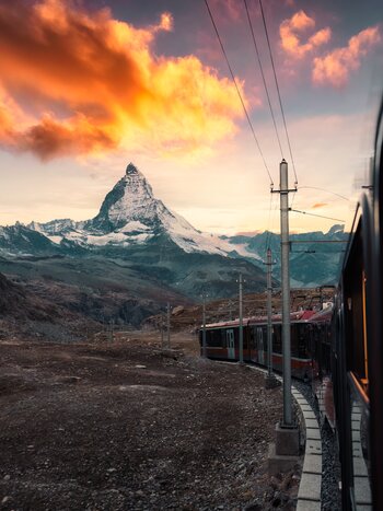 View from the train with sunrise over the Matterhorn on the journey to Gornergrat station in Riffelboden, Zermatt, Switzerland | © Shutterstock 2426237483